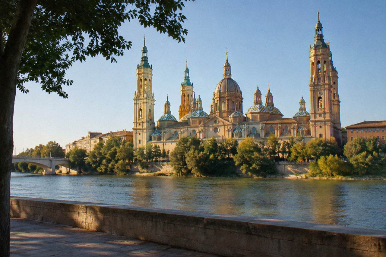 The domes and towers of the Basílica del Pilar seen from across the Ebro river in Zaragoza