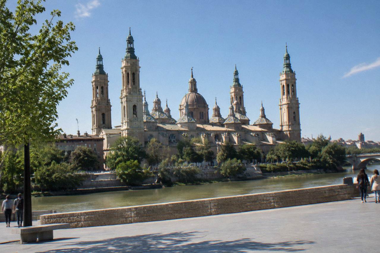 View over Zaragoza with the Basilica del Pilar and its domes rising above the Ebro riverside