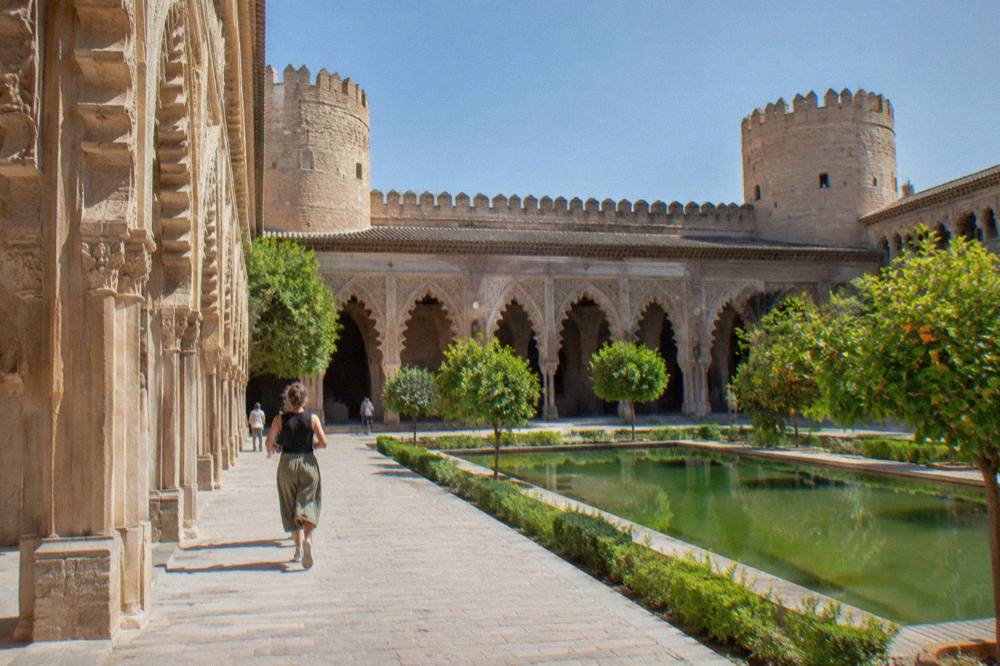 The ornate Moorish arches and carved stucco of the Aljafería palace in Zaragoza