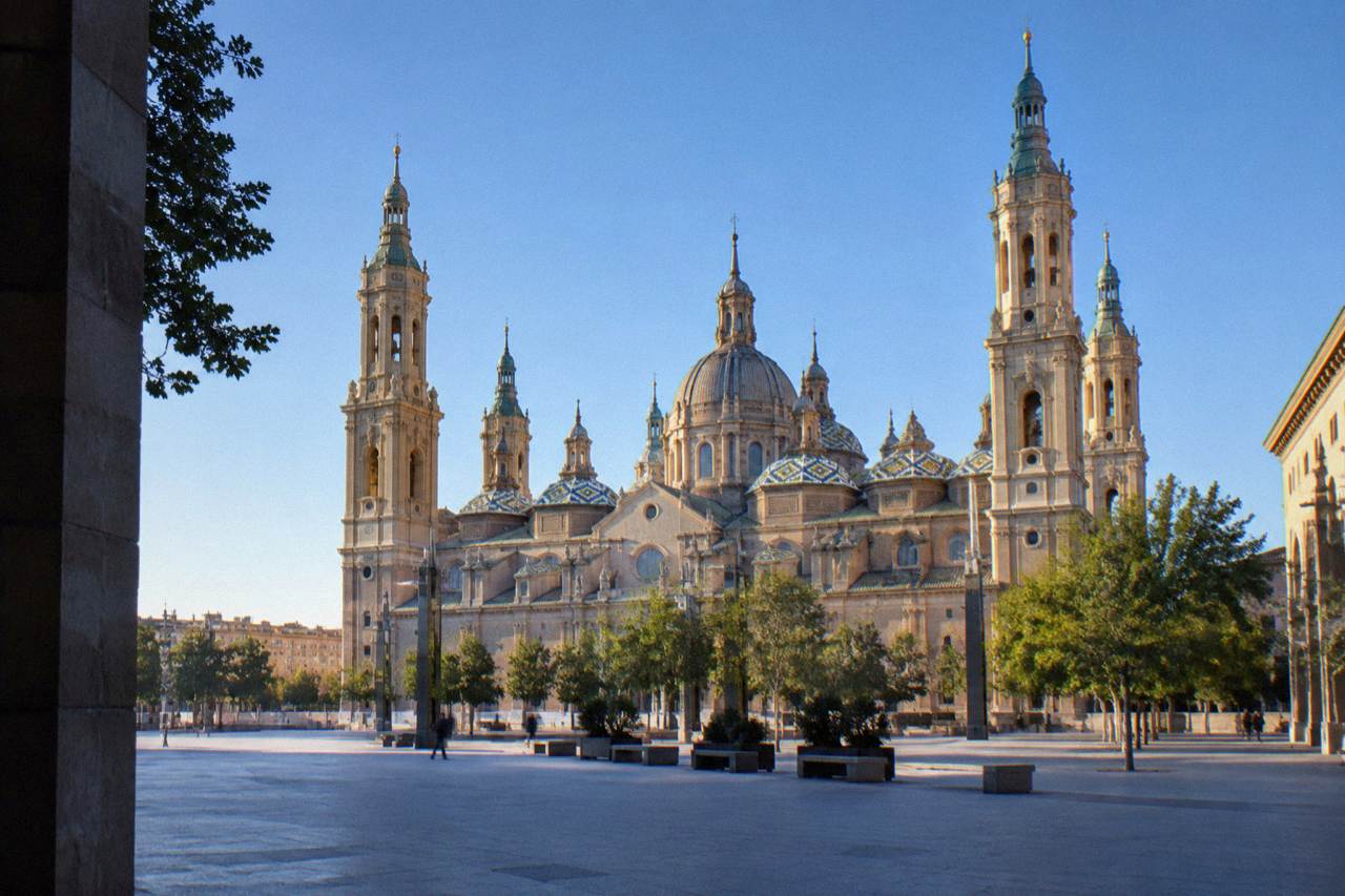The towers of the Basílica del Pilar rising above Plaza del Pilar in the morning light
