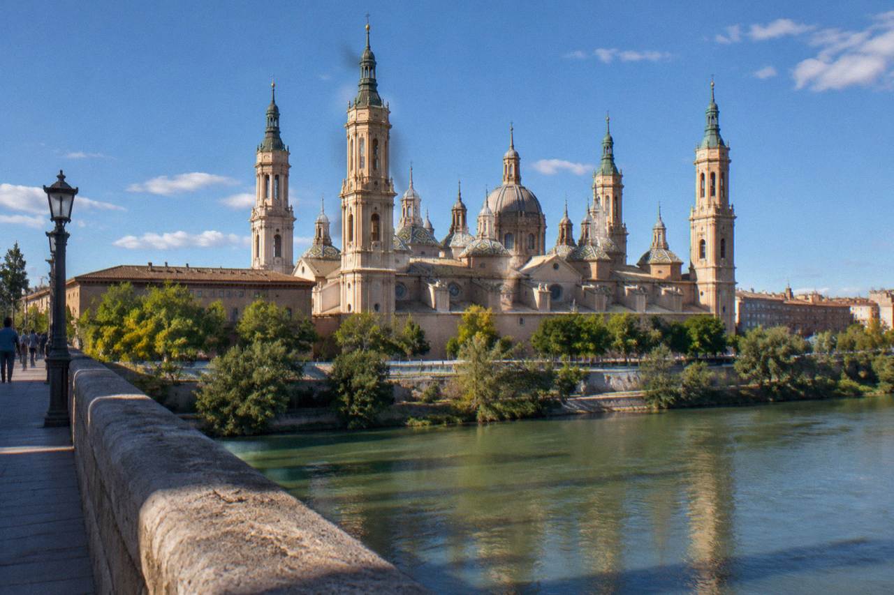 The Basilica del Pilar and the Ebro river seen from the Puente de Piedra bridge in Zaragoza