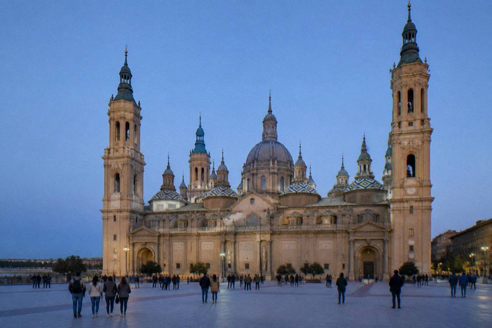 Visitors looking at the painted ceiling inside the Basilica del Pilar in Zaragoza