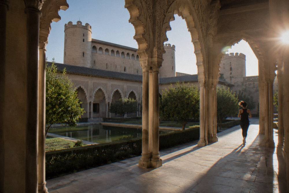 Carved stucco arches surrounding the central courtyard of the Aljaferia Palace
