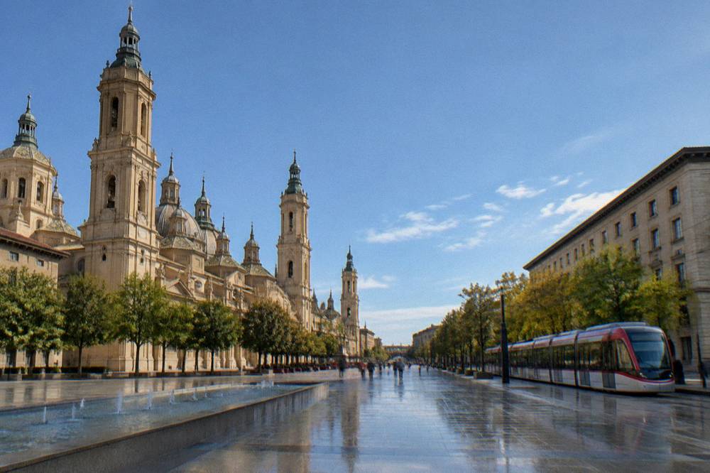 A tram passing along a tree-lined avenue in central Zaragoza