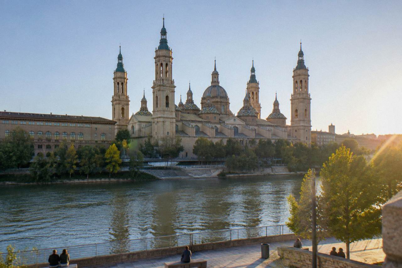 The Basilica del Pilar towers and domes rising above the Ebro river in Zaragoza