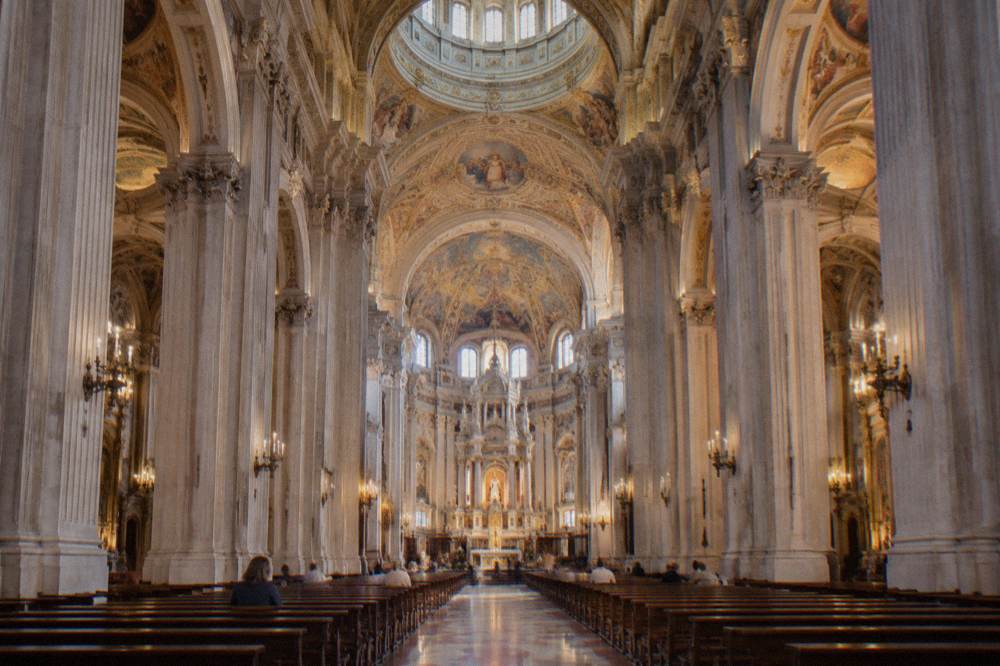 The interior nave of the Basilica del Pilar with its columns and painted ceiling