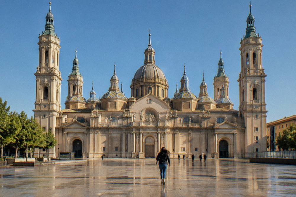 The main nave of the basilica with its painted domes and the high altar seen from the entrance