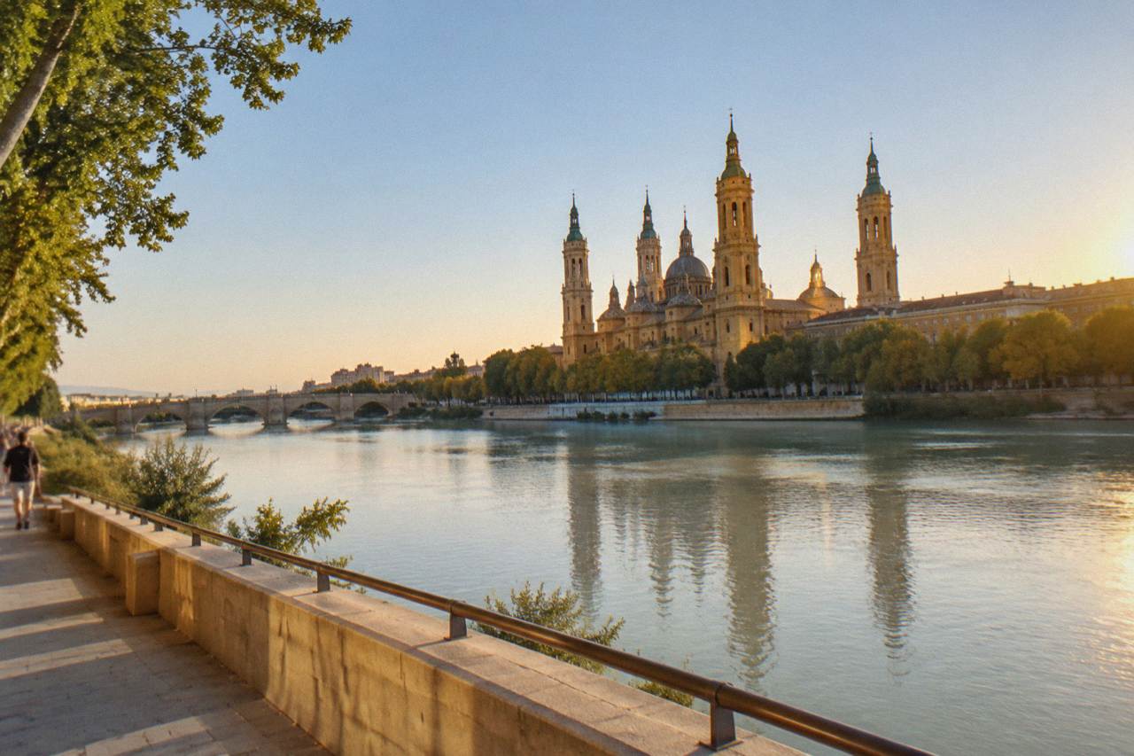 The Ebro river seen from a Zaragoza bridge with the Basílica del Pilar rising above the far bank