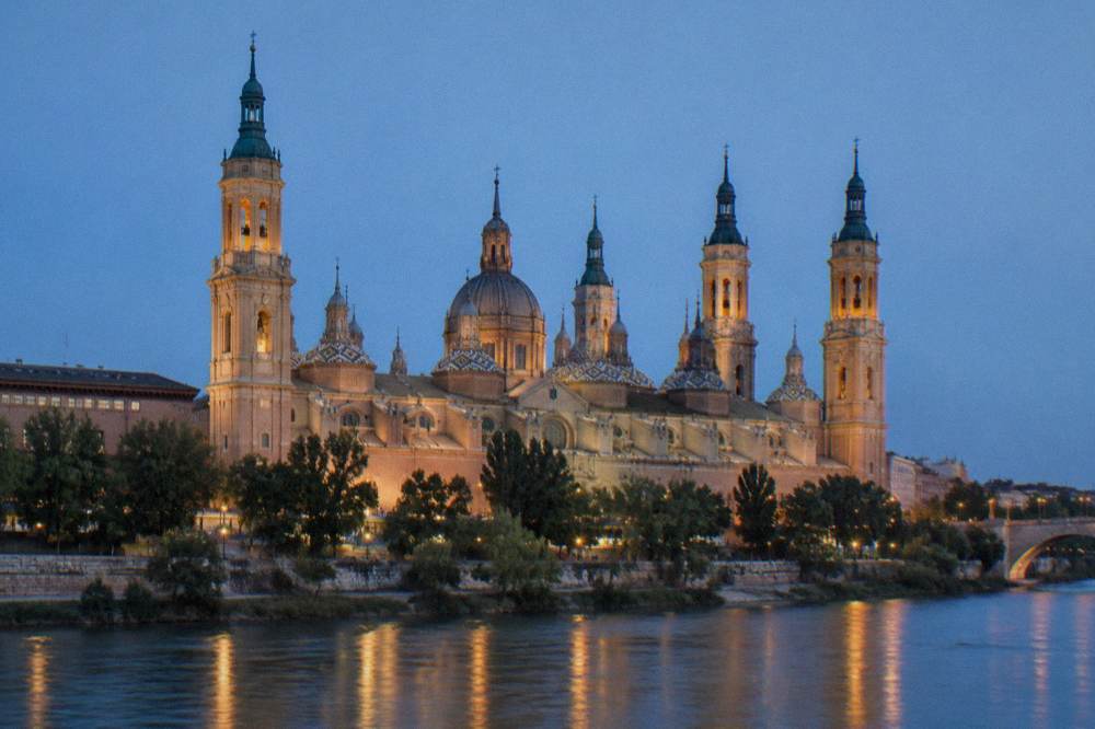 Towers of the Basílica del Pilar seen from the far bank of the Ebro in the evening