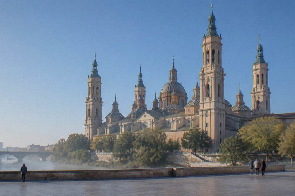 The baroque domes and towers of the Basílica del Pilar seen from across the Ebro