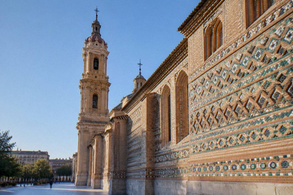 A close view of the glazed ceramic decoration on the Mudejar wall of La Seo Cathedral