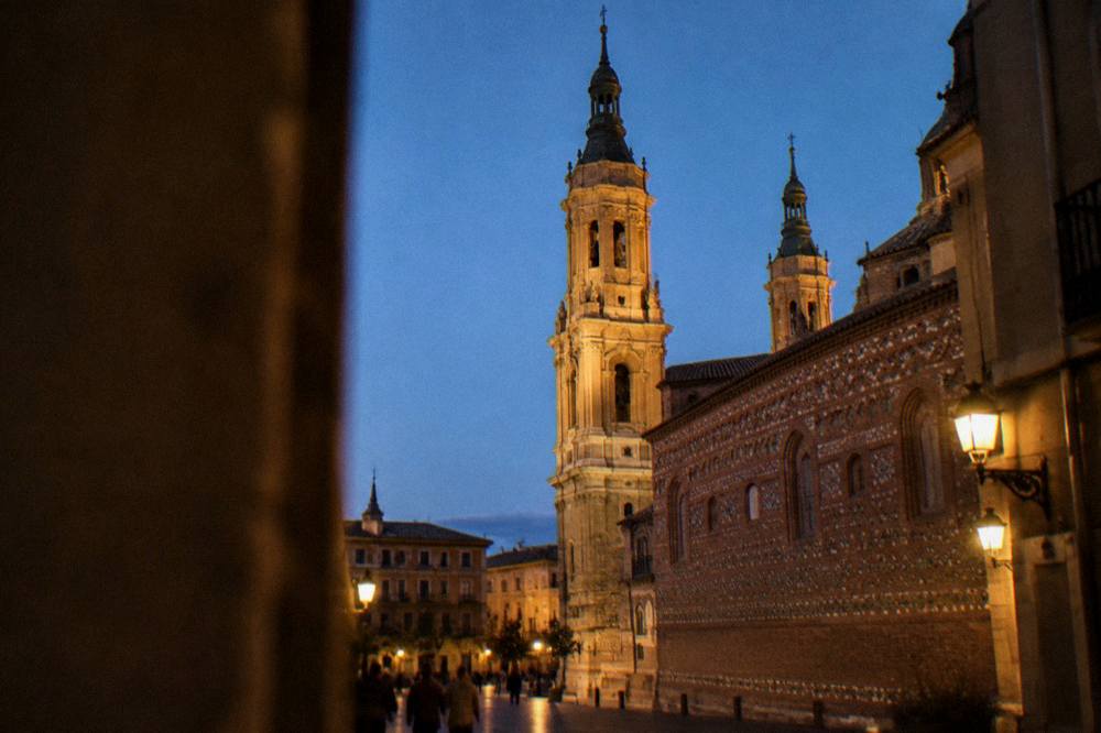 Evening light on the cathedral towers of La Seo above the rooftops of Zaragoza old town