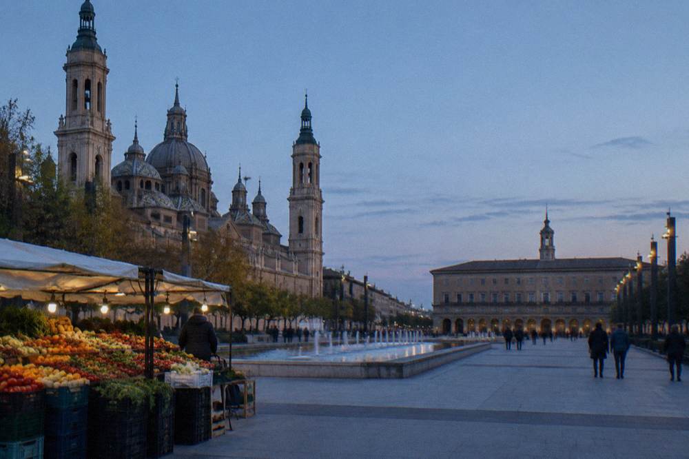 Fruit and vegetable stall with pyramids of seasonal produce at a Zaragoza market