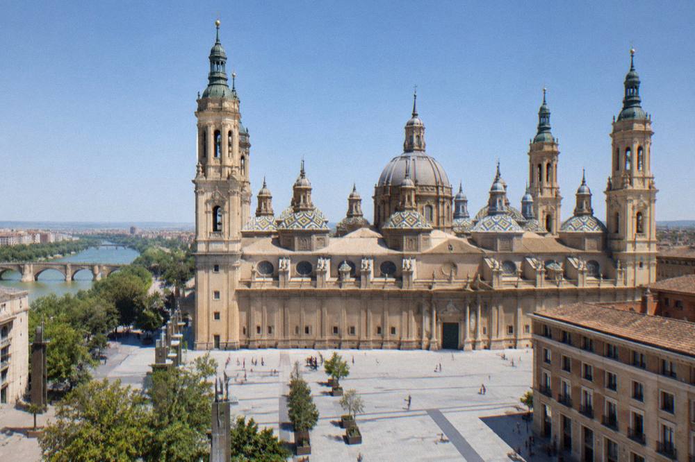 Baroque towers of the Basilica del Pilar seen across a Zaragoza square