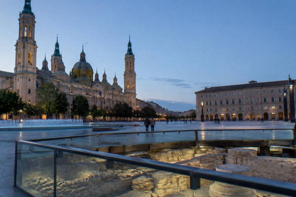 Ancient Roman stone foundations displayed inside a glass walled museum in the centre of Zaragoza