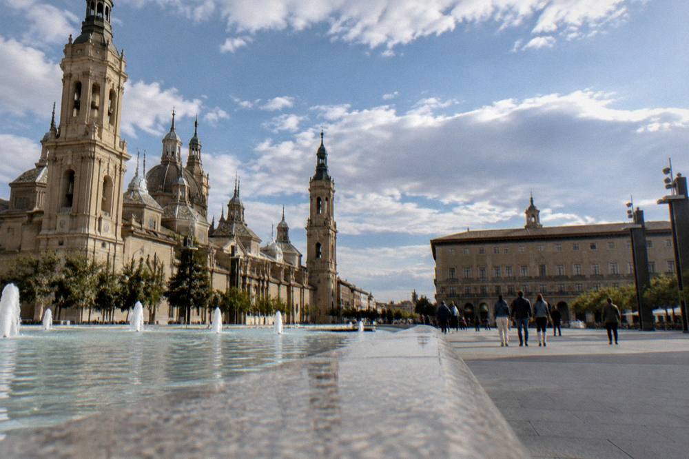 Visitors on a stone street in Zaragoza old town near the Roman sites