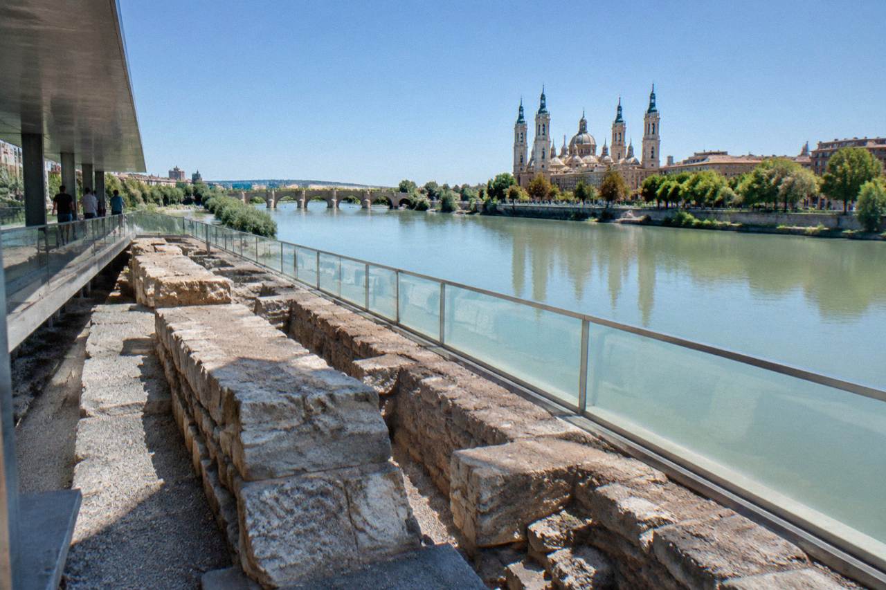 Underground archaeological gallery beside the Ebro river showing the remains of a Roman stone river bank