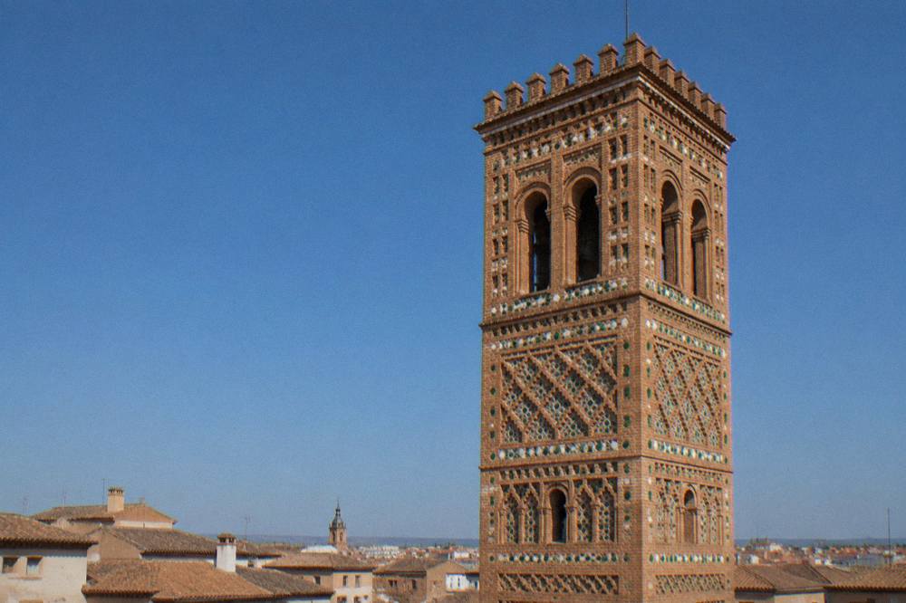 Close up of patterned red brickwork with geometric Mudejar decoration on a Zaragoza church tower