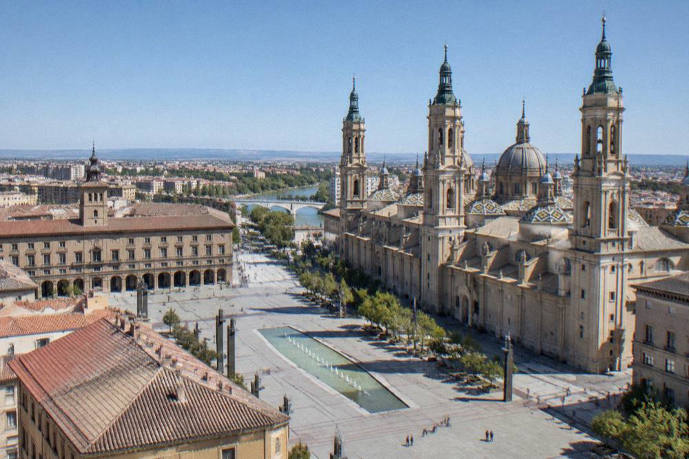A view over Zaragoza rooftops toward the Basilica del Pilar towers from an elevated viewpoint