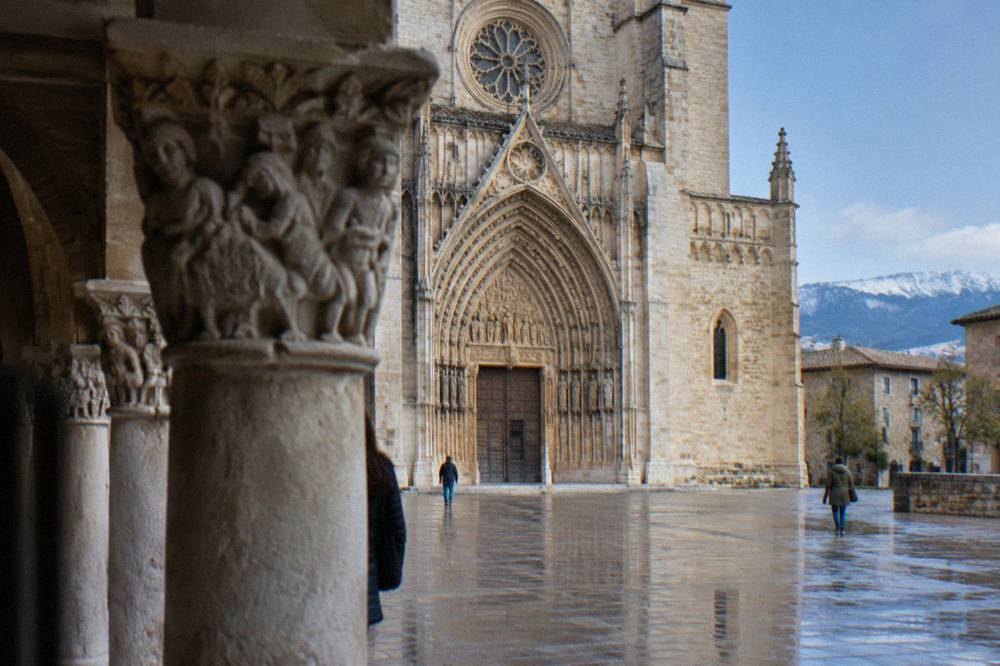 Carved Romanesque stone capitals in a cloister arcade in Huesca