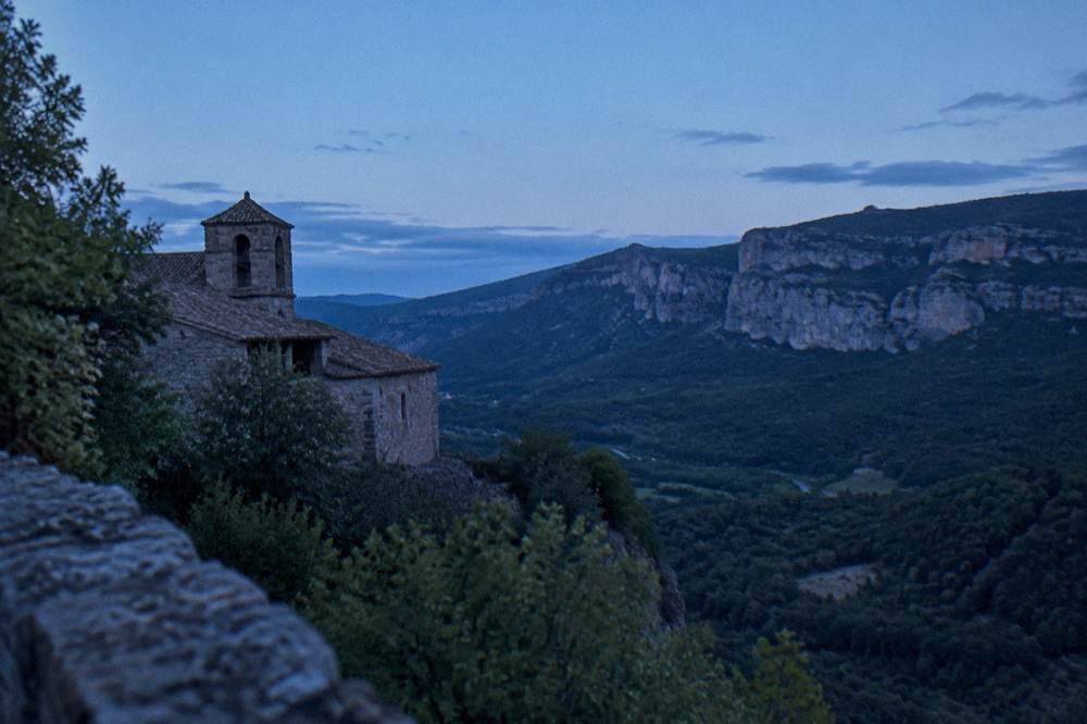 Viewpoint over wooded valleys of the Sierra de San Juan de la Peña with cliffs in the distance