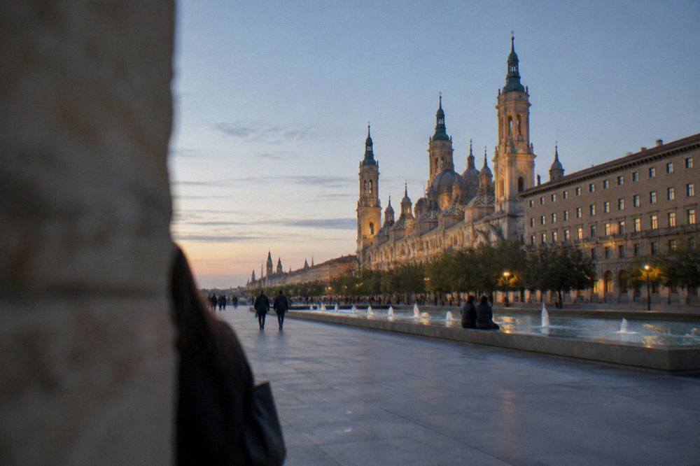 Evening light over the rooftops and towers of Zaragoza seen from across the Ebro