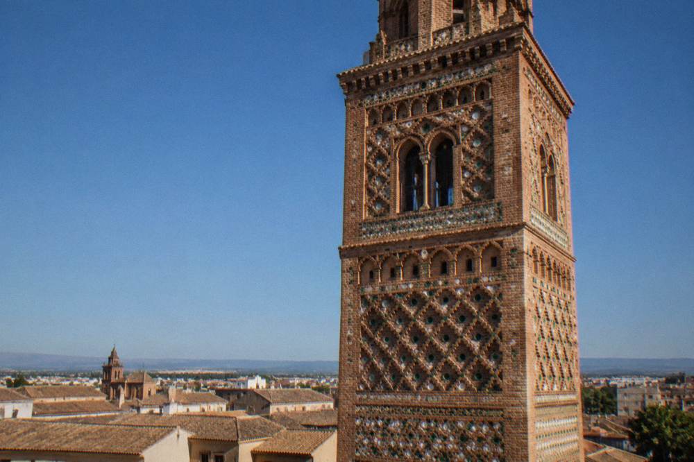 Close view of patterned Mudéjar brick decoration on an old church tower in Tarazona
