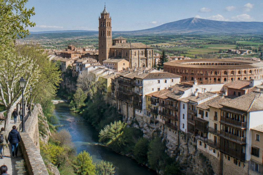 Spring countryside below the Moncayo with green fields and a stone farmhouse