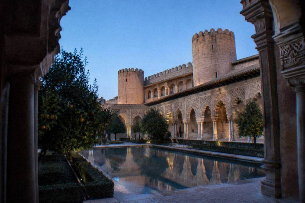 The ornate Mudéjar walls and arches of the Aljafería palace in Zaragoza