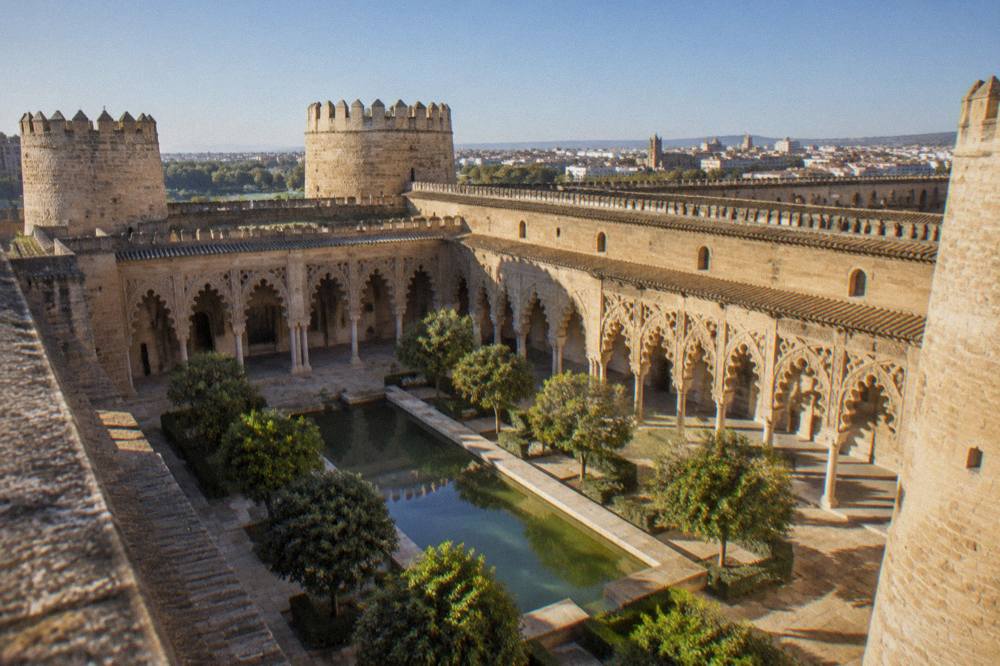 The ornate Moorish arches and courtyard of the Aljafería palace in Zaragoza