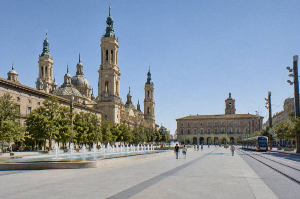 Modern hotel street in central Zaragoza with wide pavements and tram tracks