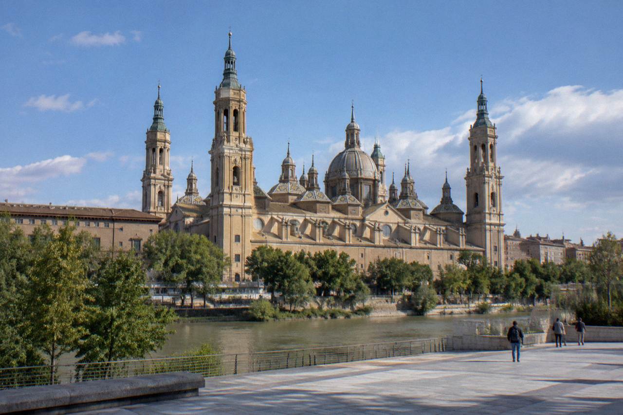 The domes and towers of the Basilica del Pilar rising above the Ebro river in Zaragoza