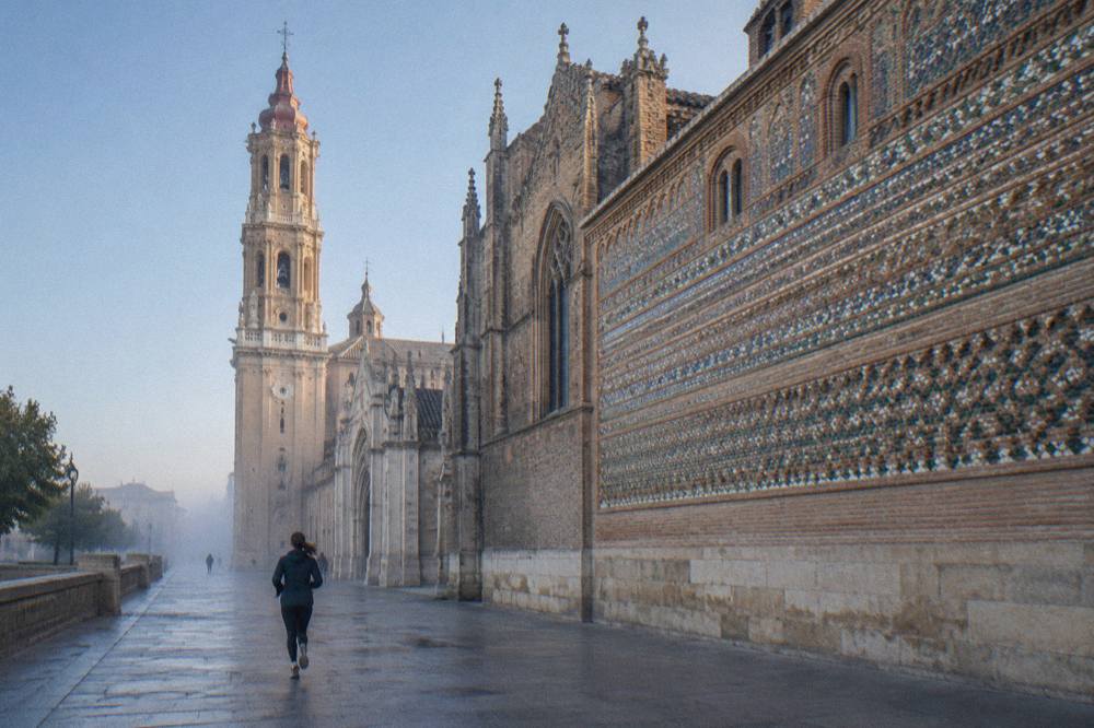 Gothic and Mudéjar exterior of La Seo cathedral in Zaragoza under a clear sky