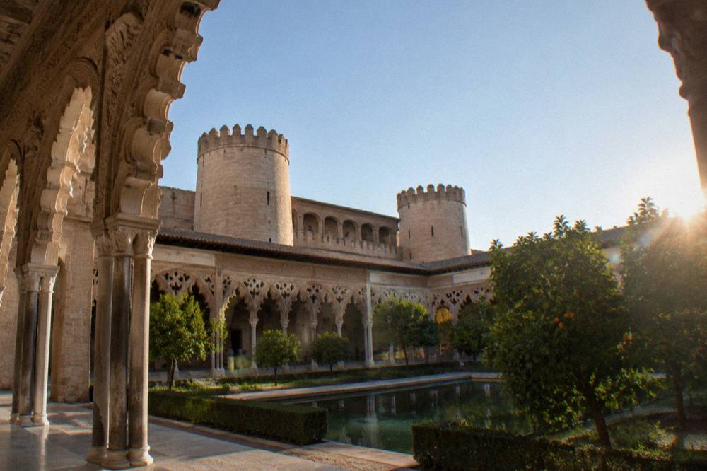 The ornate carved ceiling and arches inside the Aljafería palace in Zaragoza